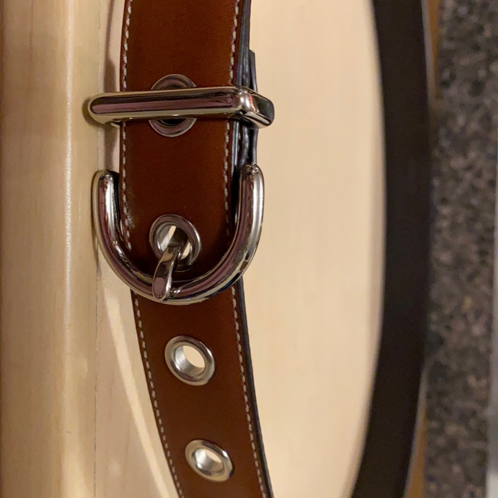 Women’s camel color Coach belt.